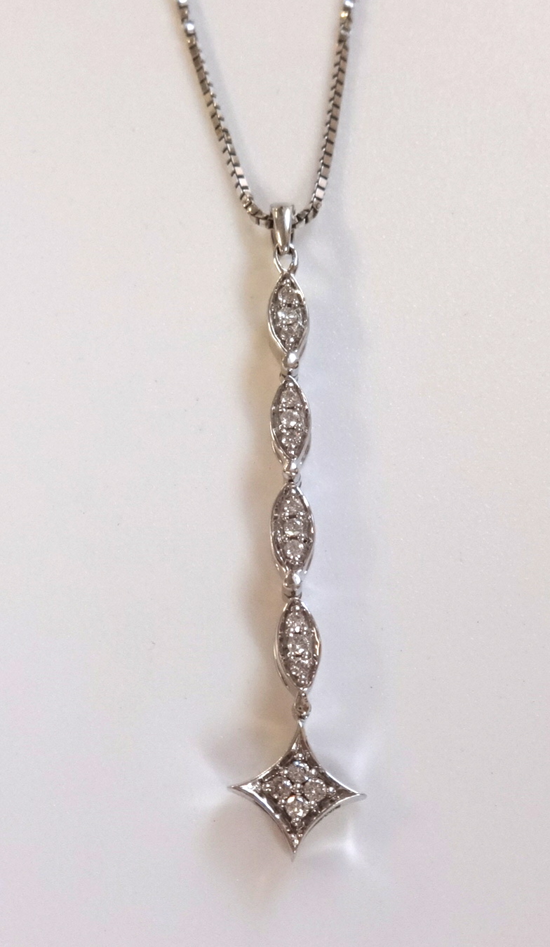 An 18ct white gold diamond pendant and chain.