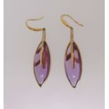 A pair of amethyst and diamond marquise shaped drop earrings, each earring comprises a cabochon