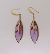 A pair of amethyst and diamond marquise shaped drop earrings, each earring comprises a cabochon
