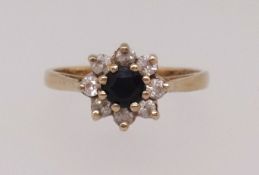 A 9ct small sapphire and diamond cluster ring, finger size M1/2.