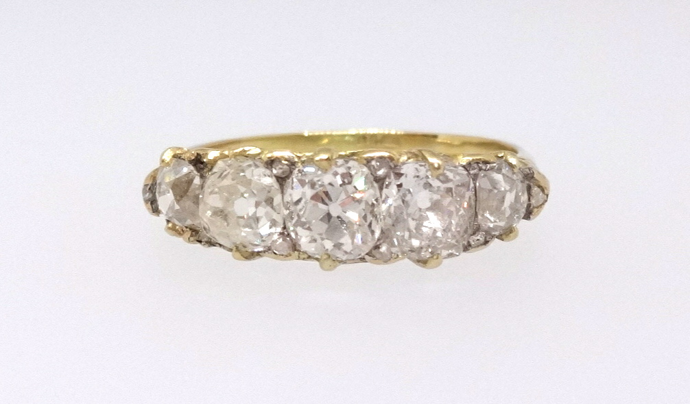 A good 18ct diamond five stone ring, finger size U/V.