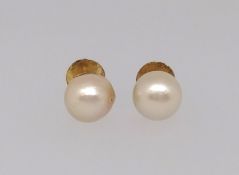 A pair of cultured pearl stud earrings, mounted in yellow metal threaded post fittings for pierced