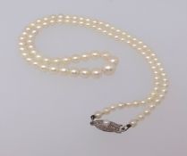 Mikimoto, a boxed set of pearls, length approx 44cm.