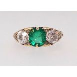 A good antique emerald and diamond three stone ring set in yellow gold unmarked, finger size L.