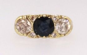 A Victorian style 18ct sapphire and diamond ring, the sapphire 5.8mm round, two diamonds approx 0.50