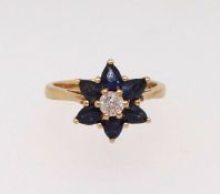 A 18ct diamond and sapphire cluster ring, finger size K.