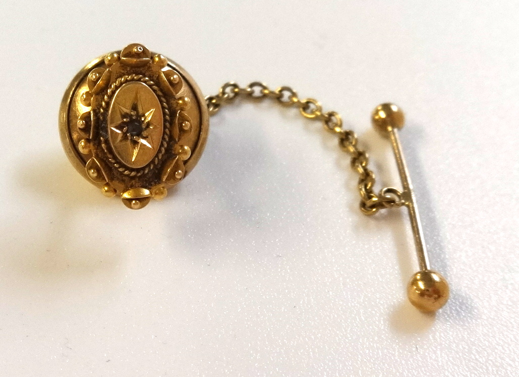 An antique 15ct yellow gold and diamond set tie retainer.