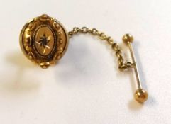 An antique 15ct yellow gold and diamond set tie retainer.