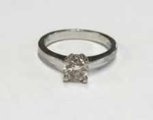 A diamond solitaire ring set in platinum, the round brilliant cut diamond approx 0.50cts, clarity