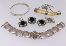 A collection of small silver wares including and bone carved brooch