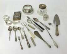 Collection of various silver wares including napkin rings, silver top jars, flatware, prayer book