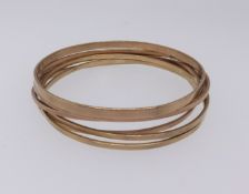 Collection of seven yellow gold bangles of slave type, 9ct gold, approx 32.4gms