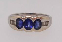 An 18ct sapphire and diamond ring set in white gold, finger size O1/2.