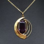 Alexandrite stone set within a stylish 9ct gold pendant on an 18ct gold chain.