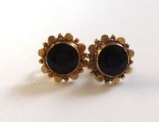 Pair of 14ct garnet set fly black earrings.