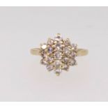 A 18ct diamond cluster ring, finger size J/K.