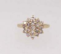 A 18ct diamond cluster ring, finger size J/K.