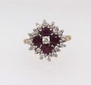 A 18ct ruby and diamond cluster ring, finger size K.