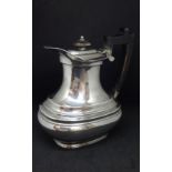 A George V silver coffee pot, height 20cm, approx 21.4oz.