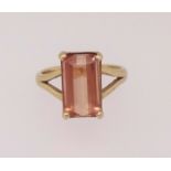 A 14ct gold peach coloured topaz, finger size R.