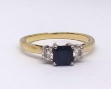 A 18ct sapphire and diamond three stone ring, finger size Q.