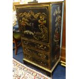 A black lacquered cabinet with oriental decoration.