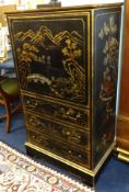 A black lacquered cabinet with oriental decoration.