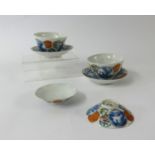 Chinese porcelain tea bowls and dishes six character marks over written and a pair of similar