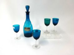 Blue glass sherry decanter and six drinking glasses.