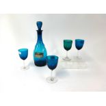 Blue glass sherry decanter and six drinking glasses.