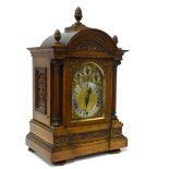 A good large Victorian oak cased mantle clock with chiming movement on a rack of gongs, the case