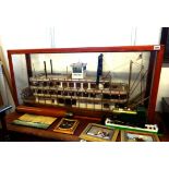 A model of a Mississippi paddle steamer in glazed cabinet, length including cabinet 112cm, height