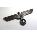 A WWII German metal plaque, width 12cm.