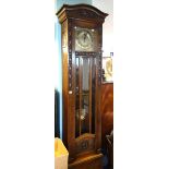 An early 20th Century oak two train longcase clock with striking movement.