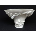 A Chinese blanc de chine libation cup, height 9cm