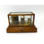 An oak cased barograph, registration number 476369.