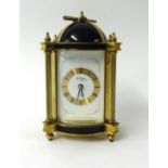 A French eight day clock with striking movement with key, height 23cm.