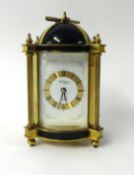 A French eight day clock with striking movement with key, height 23cm.