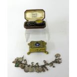 A mixed lot including pocket watch case, Isle of Man brass box, charm bracelet, enamel badges,