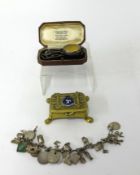 A mixed lot including pocket watch case, Isle of Man brass box, charm bracelet, enamel badges,