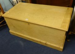 A large antique pine blanket box (stripped), width 106cm, depth 53cm.