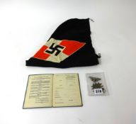 A German car flag no.28383, two badges and a German service book, unused.