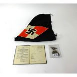 A German car flag no.28383, two badges and a German service book, unused.