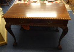 Reproduction mahogany side table with two fitted drawers and two dummy drawers on claw and ball