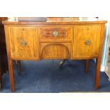 A Georgian inlaid and bow fronted mahogany sideboard fitted with two deep drawers (one a