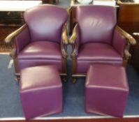 Two Victorian wood framed armchairs with later purple leather upholstery and similar pouffes.