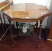 An Edwardian mahogany occasional two tier table.