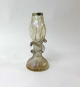 An art glass vase with silver rim.