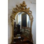 Reproduction ornate gilt framed mantle mirror.