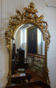 Reproduction ornate gilt framed mantle mirror.